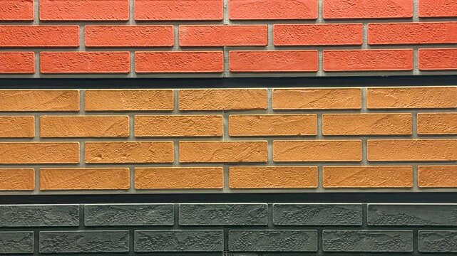 Rows of orange and gray bricks in different textures