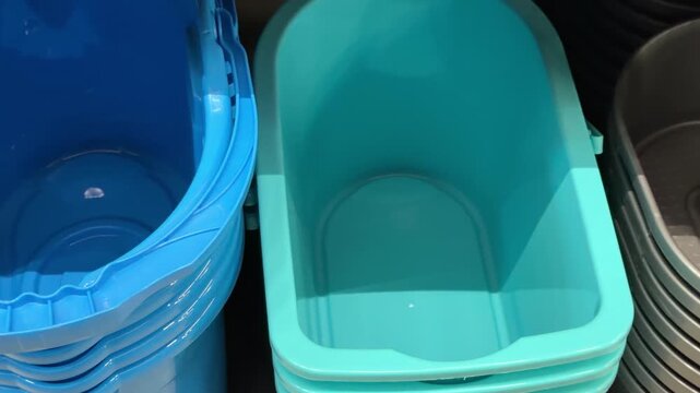 Stack of blue and teal plastic containers