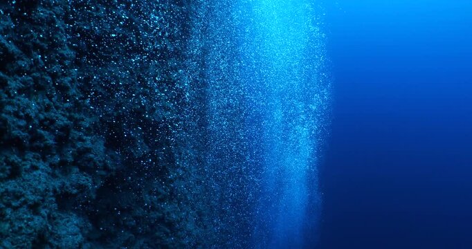 air bubbles slow  underwater coming up scenery dark blue and sun shine ocean scenery from scuba  divers backgrounds