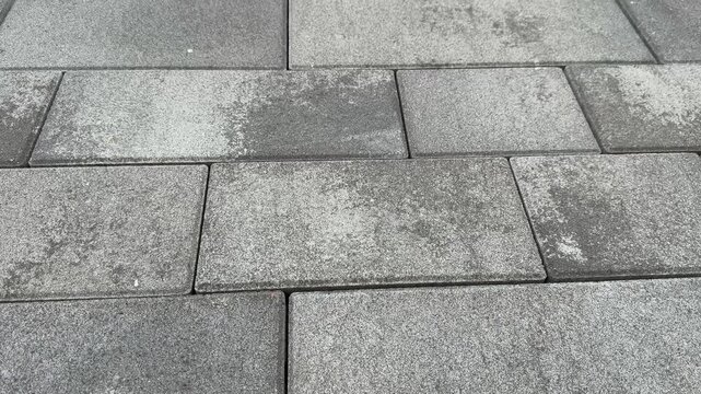 Gray paving stones forming a surface pattern
