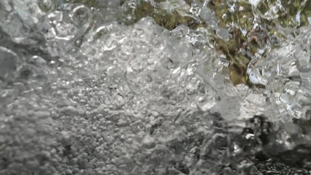 bubbles underwater makes shapes in fast flowing river fresh water