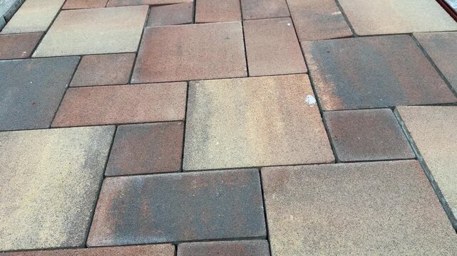Patterned paving stones form an outdoor surface