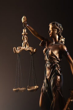 Statue of justice with scales of justice, symbol of law.
