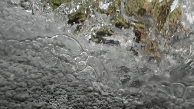 bubbles underwater makes shapes in fast flowing river fresh water