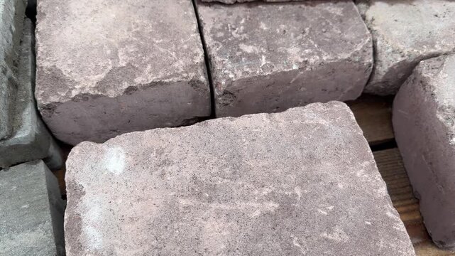 Stone blocks piled on a wooden surface