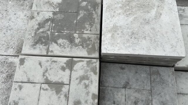 Gray concrete paving stones arranged for construction