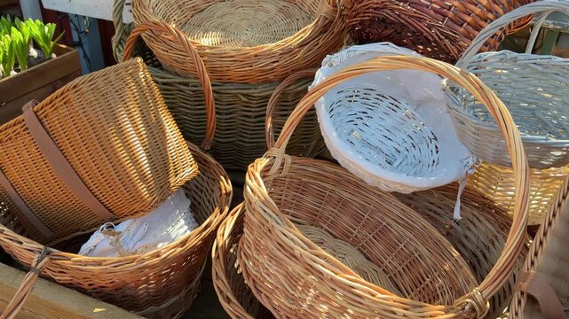 Wicker baskets of various sizes are stacked together