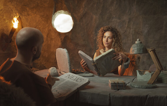 Prehistoric business people working in the office