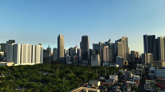 Panoramic drone shot around the Makati Central Business District at Sunrise