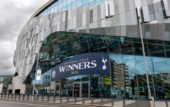 London. UK- April 17.2026. The facade of the Tottenham Hotspur Stadium with the club crest, symbol and signs above the main entrance.