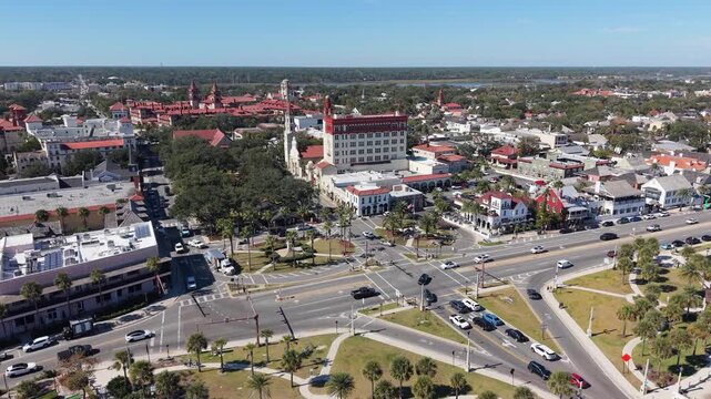 Cinematic daytime aerial footage of the historic downtown district, colonial architecture, and waterfront of St. Augustine, Florida.