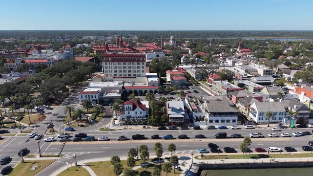 Cinematic daytime aerial footage of the historic downtown district and the Castillo de San Marcos national monument in St. Augustine, Florida.