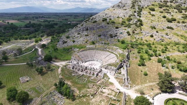 Extended drone reveal of ancient ruins within a broad historic landscape.