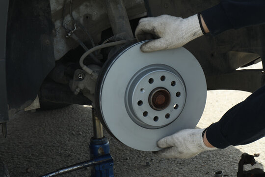 Brake disc and brake pads. Wheel disassembly and repair. Car design
