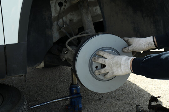 Brake disc and brake pads. Wheel disassembly and repair. Car design
