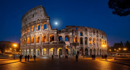 Fototapeta premium The Ancient Colosseum in Rome, Italy, Illuminated at Night Under a Dark Blue Sky with Moon