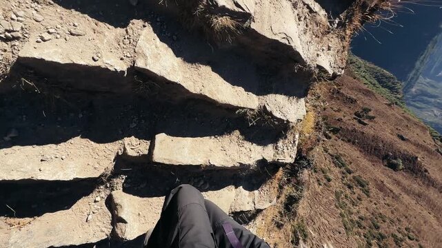 First person trekking uphill in Everest region, Nepal. Walking up mountain steps with dramatic Himalayan landscape and deep valley view, immersive travel experience