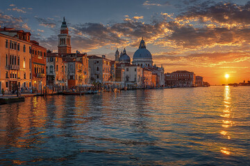 Fototapeta premium Venice Italy cityscape at sunset with historic buildings reflecting on water under dramatic cloudy sky, creating warm and peaceful atmosphere by lagoon
