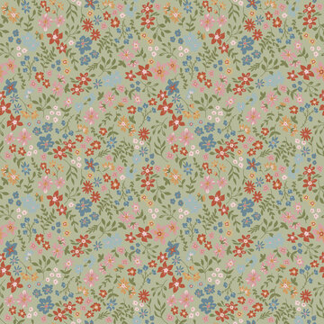 Delicate floral pattern with small blossoms on a muted green background