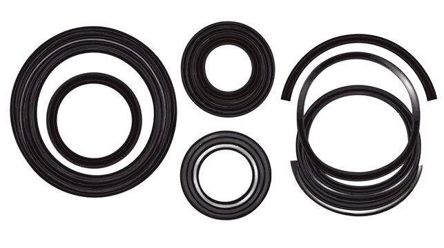 A collection of black, rubber-like circular objects, varying in size, with empty centers, on white