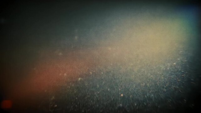 レトロ映画の粒子感と光漏れが揺らぐヴィンテージフィルム背景