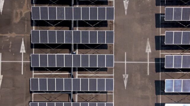 Solar Panels: Capturing an aerial view, a grid of solar panels stands as a testament to sustainable energy, seamlessly integrated into a modern parking structure.