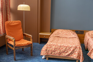 A room in the Kosmos Hotel, built for the Olympic Games-80 in Moscow. A historic room with a view of the VDNKh at the Kosmos Hotel. Retro interior in the hotel. Beds in the Cosmos Hotel room.
