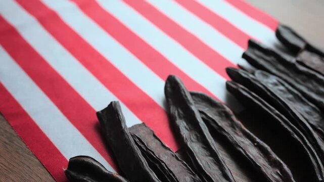 Sweet Carob Pods on American National Flag Close-up
