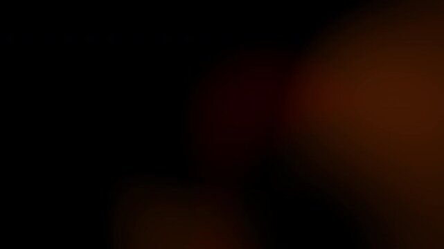 Orange/Dark Red, Bokeh/Blur, Solid Black Background. Light leaks occur when there are gaps in the camera body or lens that allow light to "leak" into the film chamber or sensor.