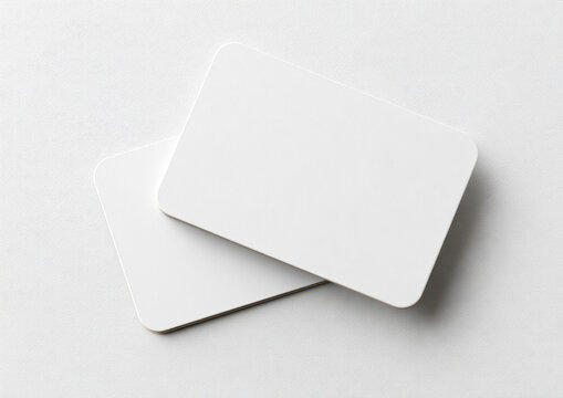 Two blank, white, rounded corner cards on a white background
