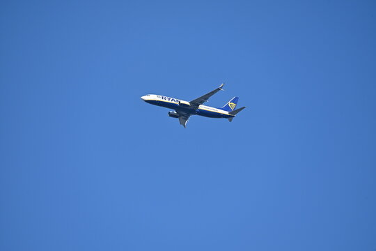 Ryanair Passenger Airplane Flying in Clear Blue Sky
