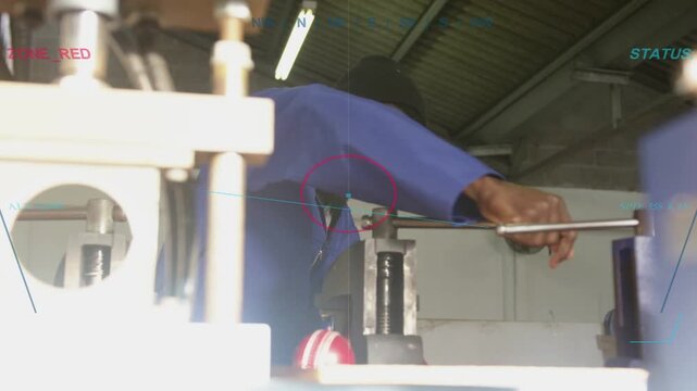 Man leaning inspecting clamped shaft, then grasping lever tightening vise for metalwork clamping