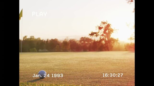 PLAY overlay starting, camera panning left, timestamp counting, golf ball sitting, showing sunset