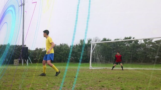 Central yellow defender holding line, dark attacker running with ball, team closing to block shot