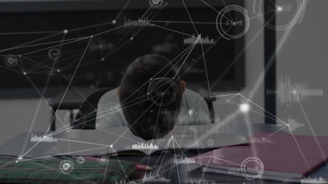 Male student reading open book and leaning toward page for study, data graphics moving across front