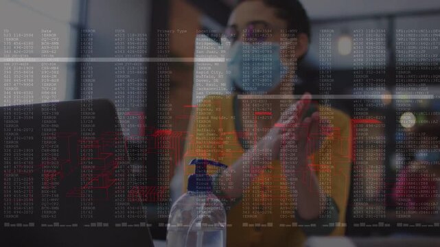 Woman at laptop pumping sanitizer rubbing hands for health, glancing as code scrolling over hands