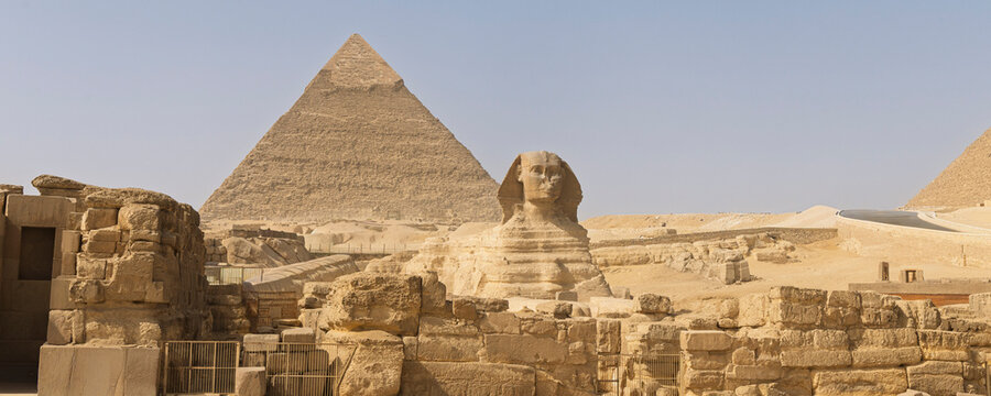 Great Sphinx and Giza pyramids near Cairo, Egypt &mdash; ancient desert monuments and archaeological landmark