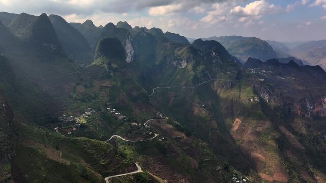 The winding road of Ma Pi Leng Pass in Vietnam. A Part of a Famous Ha Giang Loop. Beautiful destinations Asia. Aerial.