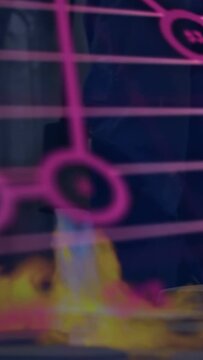 Adult moving near stage while burner nozzle sparking flame and magenta tech charts rising over legs