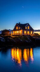 Obraz premium Cozy house by serene lake at dusk.