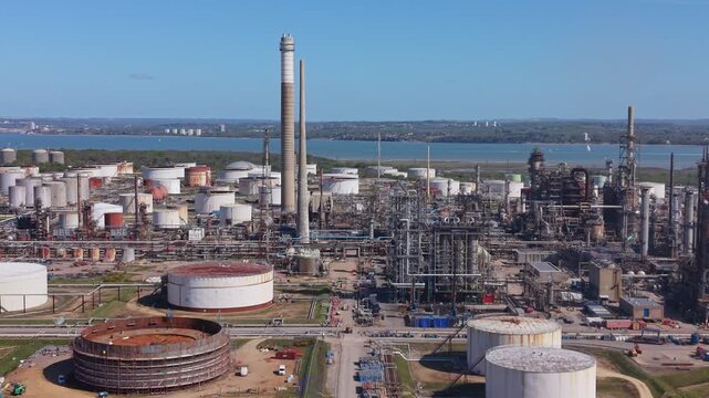 Aerial drone footage of the Fawley Oil Refinery in South Hampshire, England, showcasing a large-scale petrochemical and energy production facility