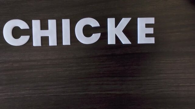 the word chicken pox written on a dark background with white block letters or capital letters (fast version)
