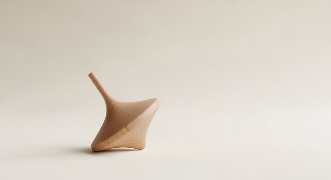 Wooden Spinning Top Toy on a Plain Background