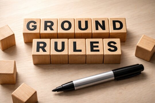 Marker and wooden blocks forming ground rules on a subtle light surface