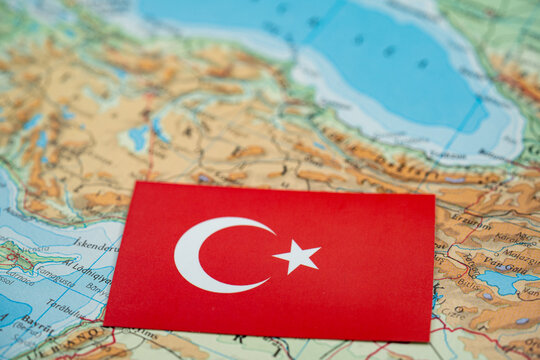 Close up of Turkey flag on map of Turkey region.
