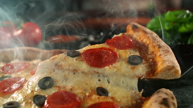 Ultra Slow Motion of Pizza with Melted Cheese Stretching Between Slices at 1000fps.