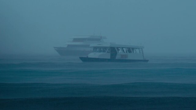 Ferry Battling Heavy Rain And Fog, Captain Steers Through Reduced Visibility While Crew Secures Deck, Distant Cruise Ship Looms In Mist As Waves Crash And Horizon Blurs Into Gray Moody Cinematic