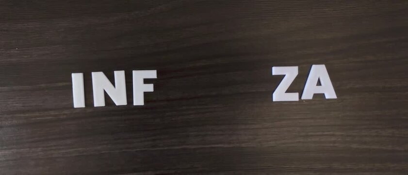 the word influenza written on a dark background with white block letters or capital letters (fast version)
