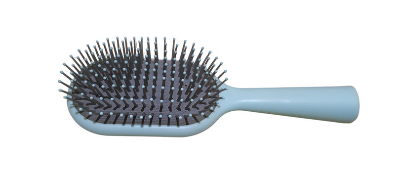 A light blue hairbrush with dark bristles is isolated on a.