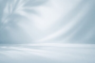 Obraz premium Elegant pale blue smooth background emphasizing shadow play for product presentations